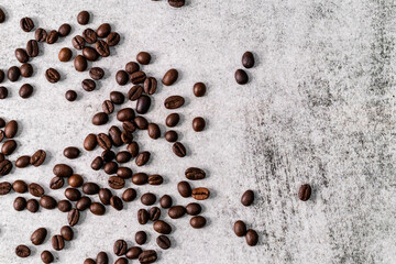 Top shot of scattered coffee beans and copy space on the side.