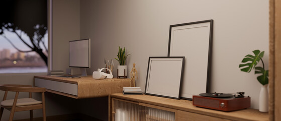 Close-up image of blank frame mockups and a vintage vinyl record player on a wooden cabinet