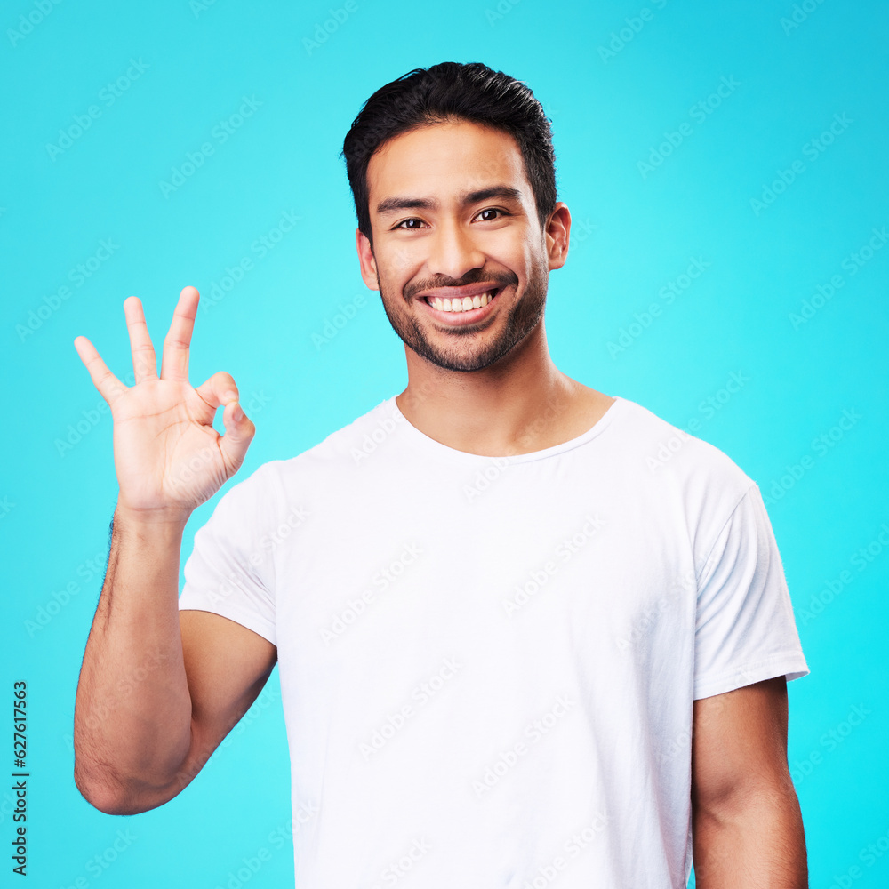 Poster happy, perfect gesture and portrait of a man in a studio with an agreement sign or expression. happi