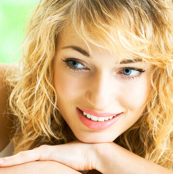 Portrait of happy cheerful smiling young beautiful blond woman, indoors