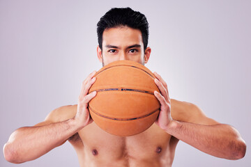 Portrait, exercise and basketball with a sports man in studio on a gray background for game...