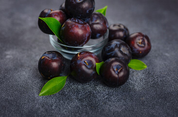 Sweet plums on dark background