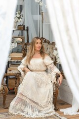 Nice blond head woman in lace vintage apricot dress. Wedding and evening dress concept
