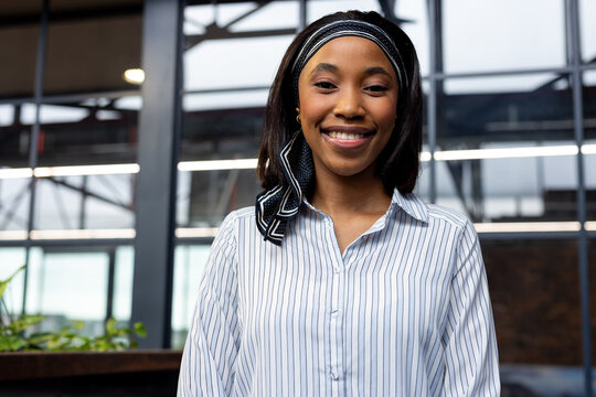 Portrait of a african american businesswoman smiling at modern office