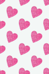 Repetitive pattern made of pink glittering hearts. Creative composition on a blue background.