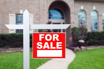 Home For Sale Real Estate Sign and Beautiful New House.