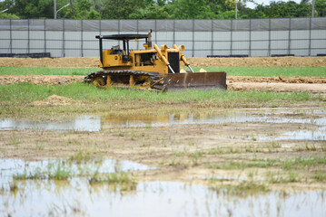bull dozer on duty in dirt area construction site © Arthiti
