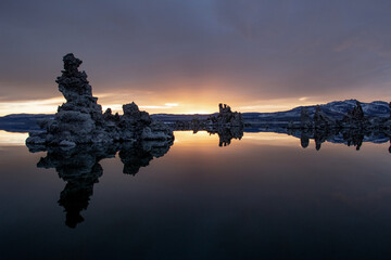 Mono Lake at sunrise on a cloudy morning with mirror-like water surface