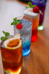 Four drink Ice Tea Blue Soda with Topping Strawberry and Cherry