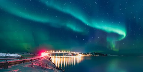 Foto op Plexiglas Sommaroy Bridge is a cantilever bridge connecting the islands of Kvaloya and Sommaroy with Aurora Borealis - Hillesoy Tromso Norway © muratart