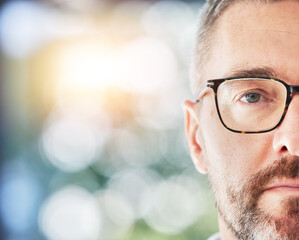 Glasses, optometry and portrait with eye of man with eyewear, spectacles and optician with bokeh. Half, face and male person with stylish frame, vision from optometrist and eyesight with mockup space