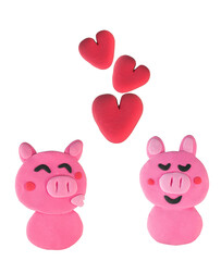 Set of Kissing pig made from plasticine on white