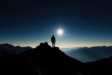 Silhouette of a Person on the Mountain Top