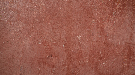 texture of a pink wall, surface of old cement wall, close-up. wrinkles of the old cement wall to use as a background image in advertisements, brochure, leaflet, the internet