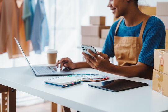 Pretty African American sme business woman working Custom Ecommerce Packaging leading supplier of custom packaging. create a personalised experience, fast production and competitive pricing