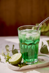 Refreshment healthy detox citrus green sparkling mocktail. Non alcoholic vitaminized healthy beverage. Green Appletini Mocktail for St. Patricks Day.