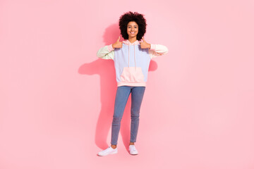 Full length photo of confident cool little child dressed hoodie showing two thumbs up isolated pink color background