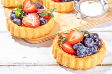 Sponge mini tart cakes with summer berry