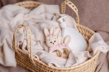 Cute baby accessories for babies on light background. Shampoo and soap for newborns. 