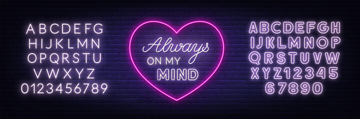 Always on my mind neon lettering on brick wall background.