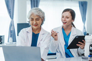 Health care researchers working in life science laboratory, Teaching in labs - Requiring students...