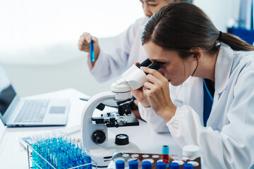 Health care researchers working in life science laboratory, Teaching in labs - Requiring students...