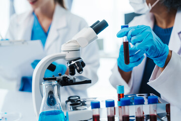 Fototapeta premium Health care researchers working in life science laboratory, Teaching in labs - Requiring students to record their laboratory methods and results as a running record of their laboratory work.