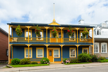 Fototapeta premium Early 20th Century two-family blue wooden house with ornate porches, Beauport area, Quebec City, Quebec, Canada