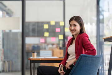 businesswoman smile working in office , sticky papers notes on glass wall, Business design planning concepts