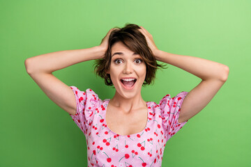 Photo of impressed funky girl dressed print top open mouth arms head isolated green color background