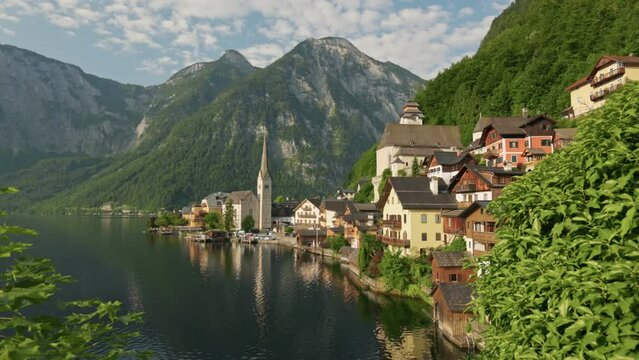 Hallstatt village at sunrise, Austria. Gimbal shot of Hallstatt village on Hallstatter lake in Austrian Alps. Morning 4K shot