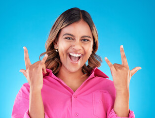 Happy, portrait and woman with rocker hands in studio for freedom, fun and positive attitude on...