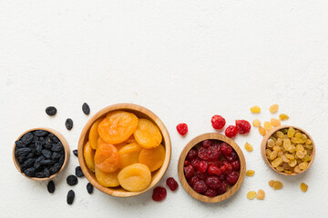 Bowl with different dried fruits on table background, top view. Healthy lifestyle with copy space