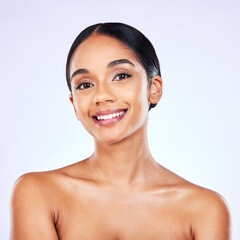 Portrait, beauty and skincare with a model woman in studio on a gray background for natural wellness. Face, smile and aesthetic with a happy young person posing for luxury cosmetics or dermatology