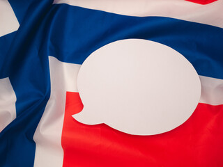 Top view of a blank white speech bubble on the Norway flag background.