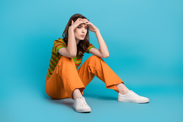 Full length photo of minded ponder pensive girl wear striped shirt arms on forehead look empty...