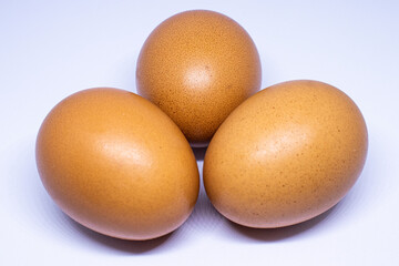 three eggs with white background