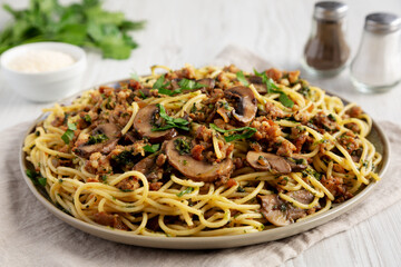 Homemade Mushroom, Spinach & Sausage Spaghetti on a Plate, low angle view.