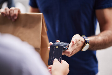 Hands, paper bag and delivery with credit card, payment and fintech for remote customer experience. Man, woman and package for lunch, e commerce and fast food shipping with supply chain employee