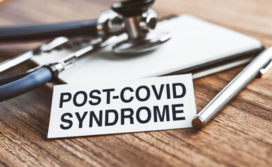 Post-covid syndrome symbol. White card with inscription. Medical and post-covid syndrome concept. Copy space.