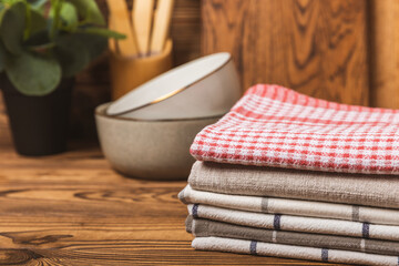 Kitchen towel. Kitchen utensils and textiles. A stack of cotton towels on the table. Stylish...