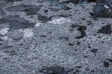 Foam from water in a rushing stream