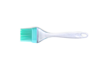 Green silicone cooking brush on a white background.