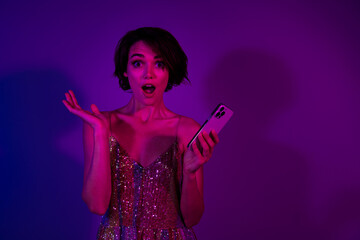 Fototapeta premium Photo of lady have friday weekend fun impressed nightclub web information on gadget isolated neon color background