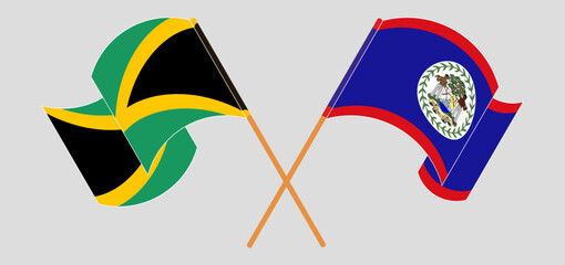 Crossed and waving flags of Jamaica and Belize