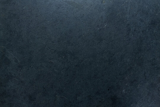 Seamless black concrete floor tile background