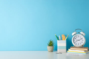 Promote a productive study environment with side-angle photo featuring white desk, alarm clock,...