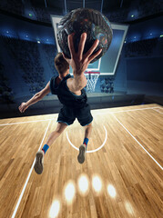 Winner. Top view image of muscular man, basketball player in motion during match, jumping, throwing...