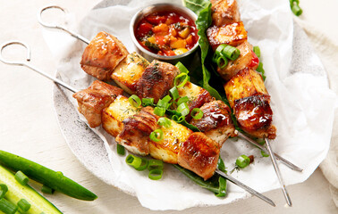 Kebab skewers on a plate.