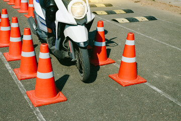 Man is learning to ride a bike Biker beginner on a motorcycle . Test Blance